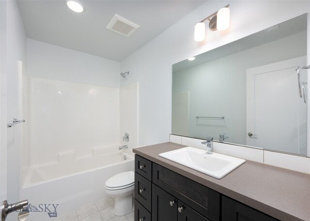 full bathroom featuring washtub / shower combination, tile patterned floors, vanity, and toilet