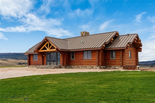 cabin with a front yard