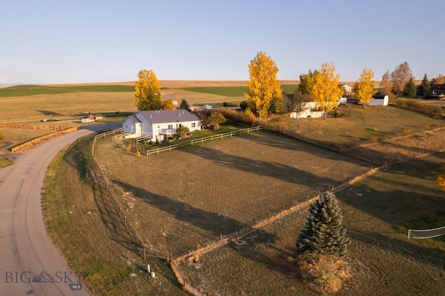 birds eye view of property with a rural view