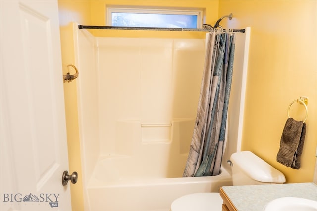 full bathroom with vanity, shower / tub combo with curtain, and toilet