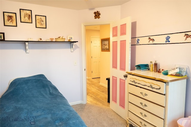 bedroom with light hardwood / wood-style flooring