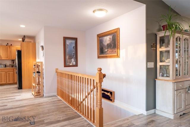 corridor featuring light hardwood / wood-style floors