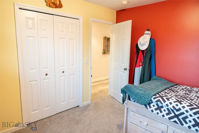 carpeted bedroom featuring a closet