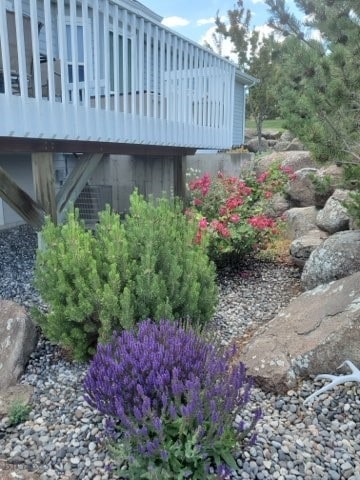 view of side of property featuring a deck