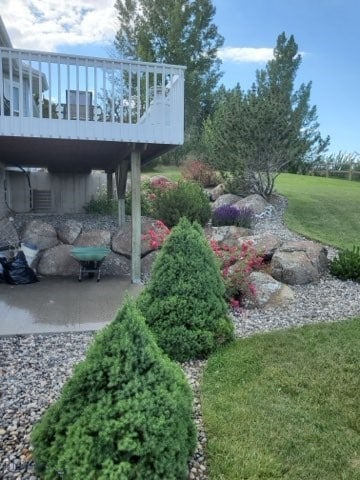 view of yard with a wooden deck