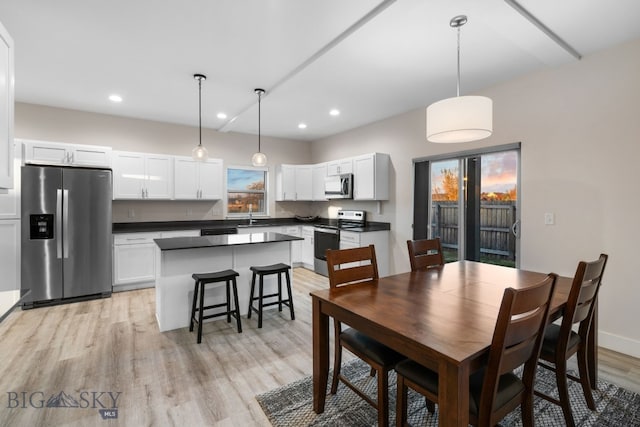 dining room with light hardwood / wood-style flooring