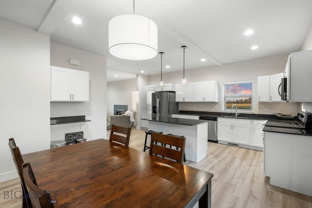 dining room featuring light hardwood / wood-style floors and sink