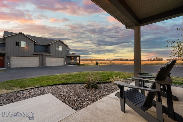 patio terrace at dusk with a garage