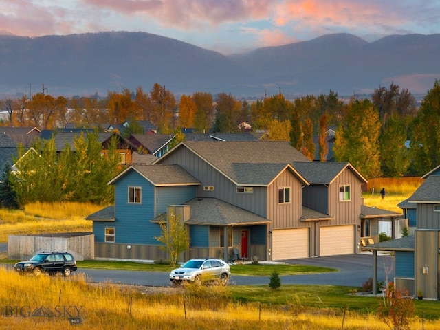 view of front of home featuring a garage and a mountain view