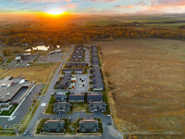 aerial view at dusk with a water view