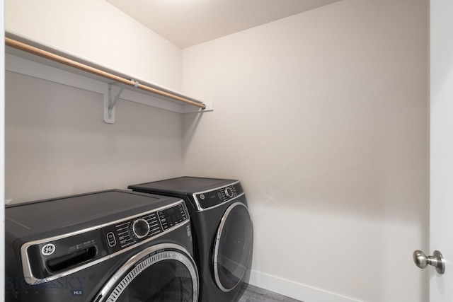 laundry room with separate washer and dryer