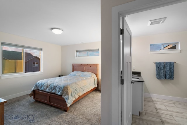 bedroom featuring multiple windows