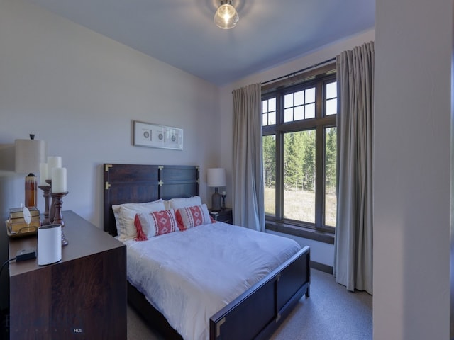 bedroom featuring light carpet