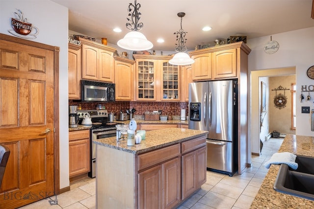 kitchen featuring a kitchen island, decorative backsplash, stainless steel appliances, decorative light fixtures, and light tile patterned floors