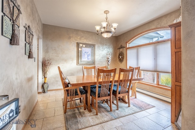 dining room with a notable chandelier and baseboard heating