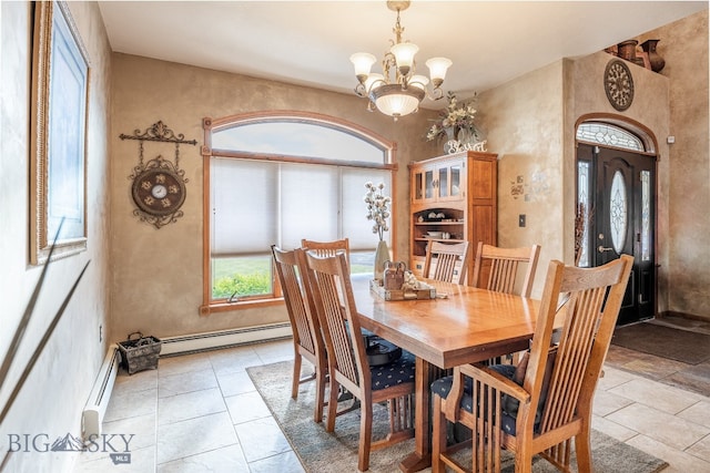 dining room with an inviting chandelier and a baseboard heating unit