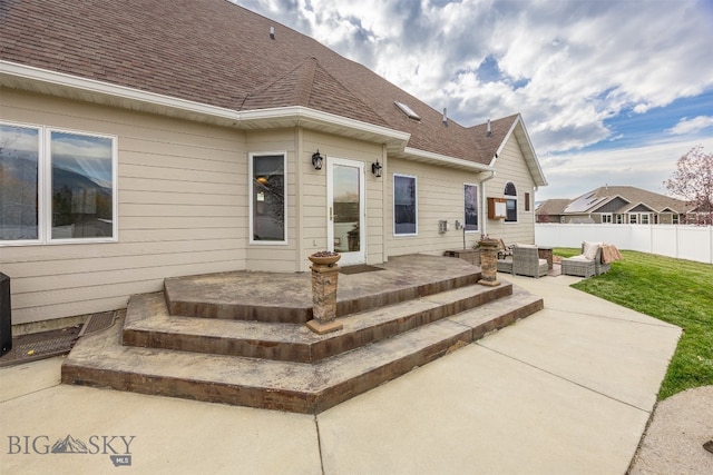 back of property featuring a patio area