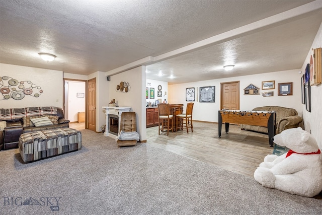 bedroom featuring hardwood / wood-style floors and a textured ceiling