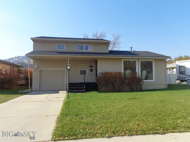 view of front facade with a porch, a front yard, and a garage