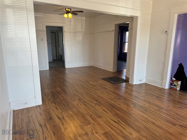 unfurnished room featuring ceiling fan and dark hardwood / wood-style flooring