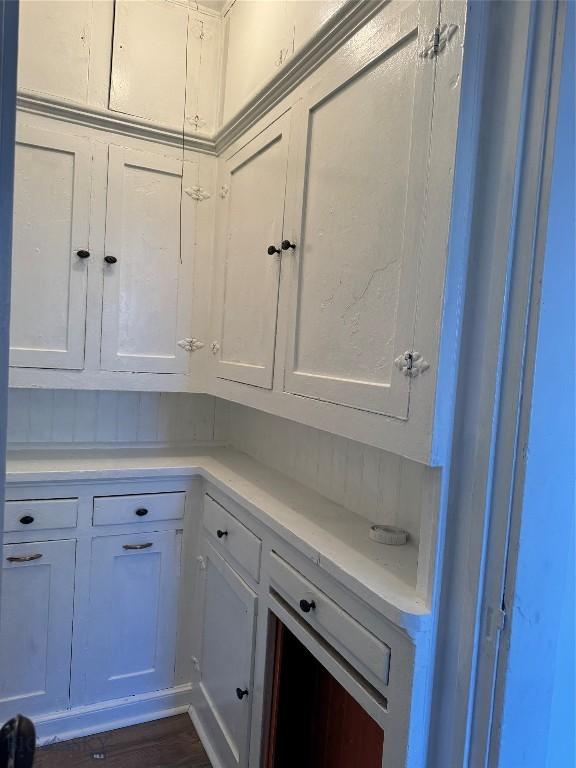 1705 Wall, Butte, MT 59701 - kitchen with light countertops, white cabinets, and dark wood finished floors