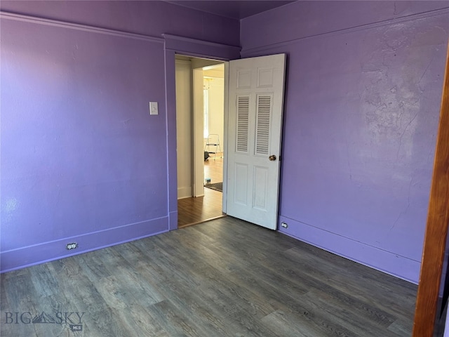 spare room featuring dark hardwood / wood-style floors