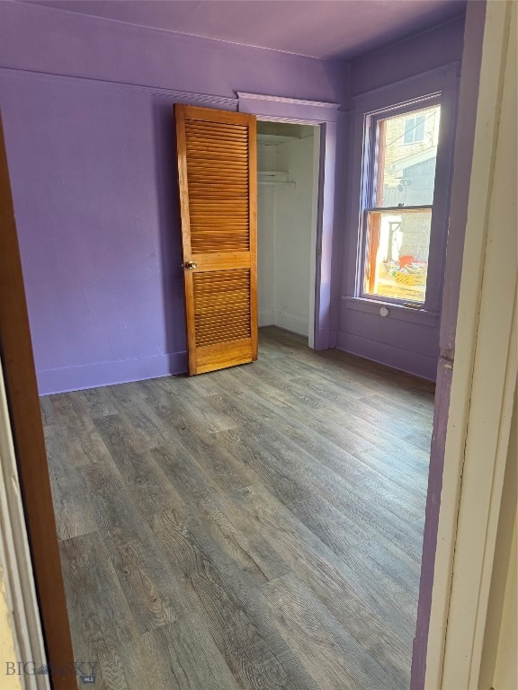 spare room with wood-type flooring