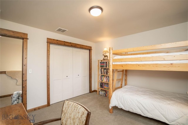 carpeted bedroom with a closet