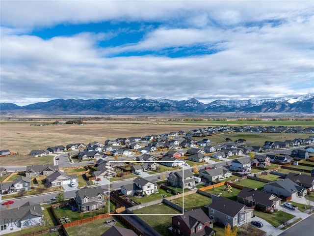 birds eye view of property with a mountain view