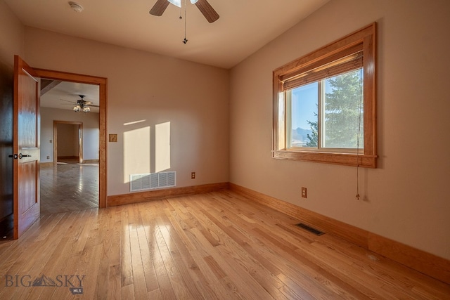 unfurnished room featuring ceiling fan and light hardwood / wood-style flooring