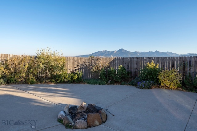 view of patio / terrace featuring a mountain view