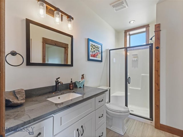 23 Caspari Way E, Emigrant, MT 59027 - bathroom with vanity, a shower stall, and wood finished floors