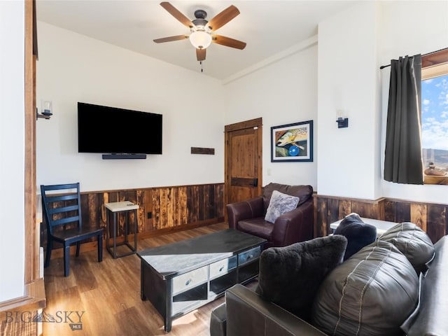 23 Caspari Way E, Emigrant, MT 59027 - living area with ceiling fan, wainscoting, wood finished floors, and wooden walls