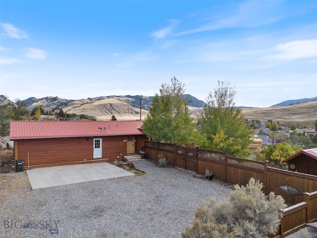 exterior space featuring a patio area and a mountain view