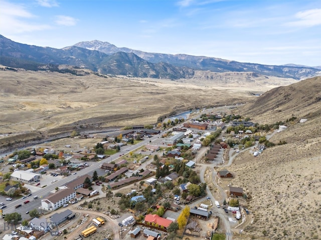 birds eye view of property with a mountain view