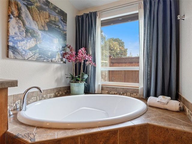 bathroom featuring tiled bath