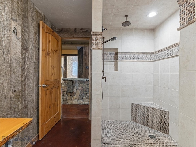 bathroom with a tile shower