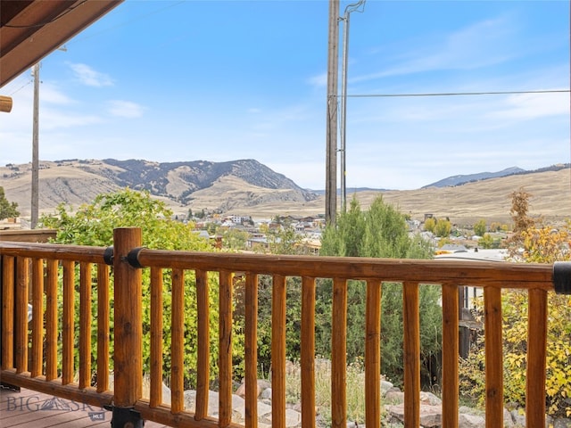 wooden deck with a mountain view