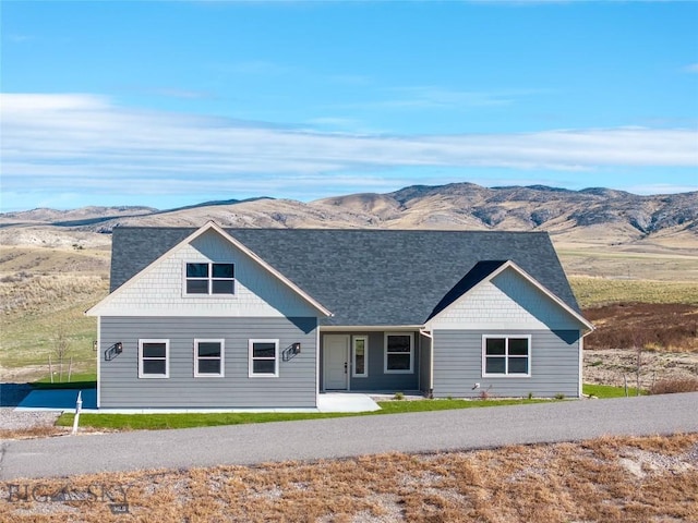 ranch-style home with a mountain view