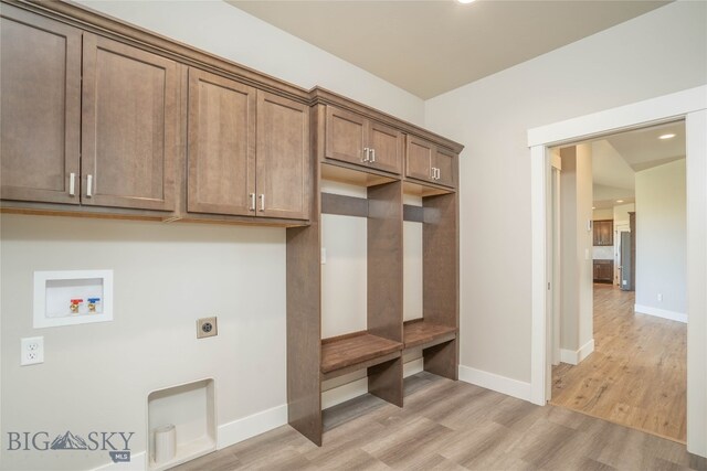 mudroom with light hardwood / wood-style floors