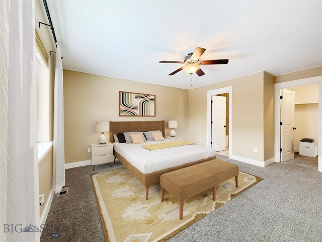 bedroom with ceiling fan and carpet floors