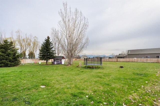 97 Ghost Canyon Ct, Belgrade, MT 59714 - view of yard featuring a trampoline and fence