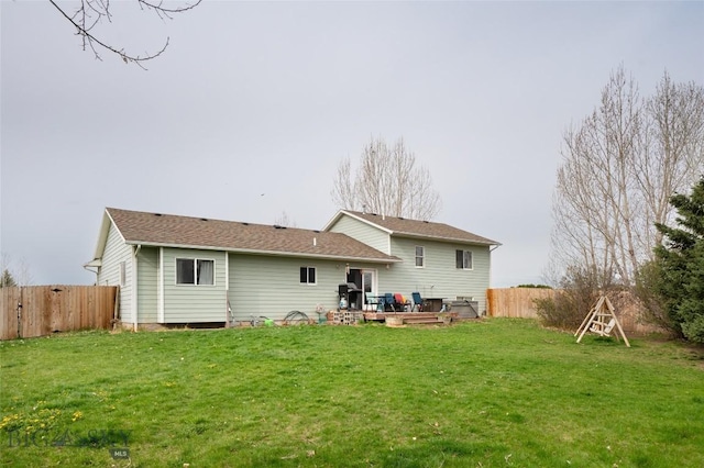 97 Ghost Canyon Ct, Belgrade, MT 59714 - rear view of house featuring a deck, a yard, and a fenced backyard