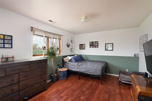 bedroom featuring dark wood-type flooring