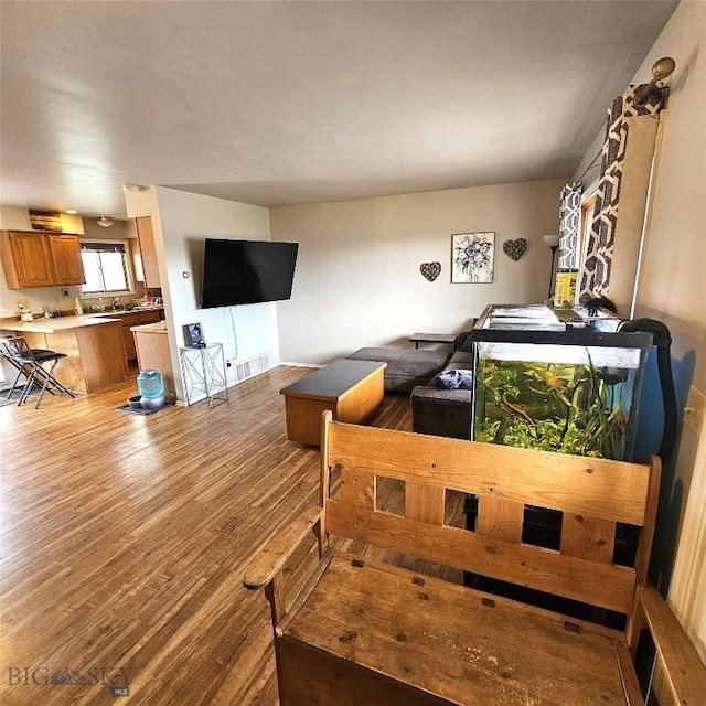 97 Ghost Canyon Ct, Belgrade, MT 59714 - living room with wood finished floors and visible vents