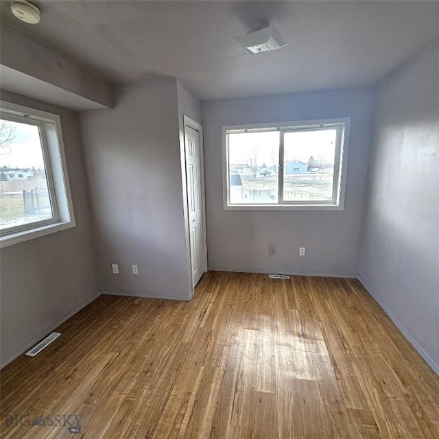 97 Ghost Canyon Ct, Belgrade, MT 59714 - interior space featuring baseboards, visible vents, and wood finished floors