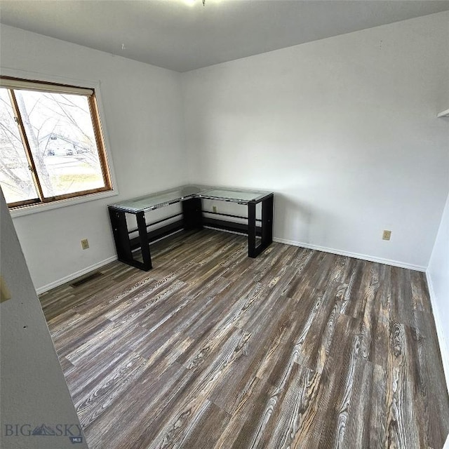 97 Ghost Canyon Ct, Belgrade, MT 59714 - unfurnished room featuring visible vents, wood finished floors, and baseboards