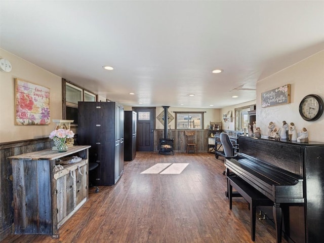 193 Tobe Rd, Ennis, MT 59729 - kitchen featuring a wood stove, wood finished floors, glass insert cabinets, and recessed lighting