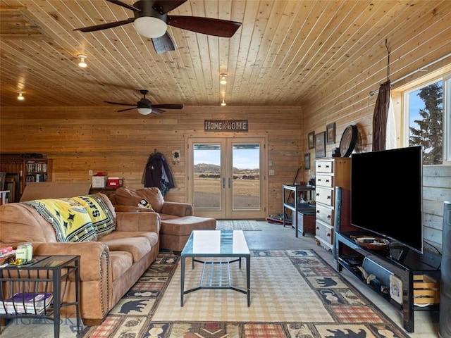 193 Tobe Rd, Ennis, MT 59729 - living room with a ceiling fan, wooden ceiling, wood walls, and french doors