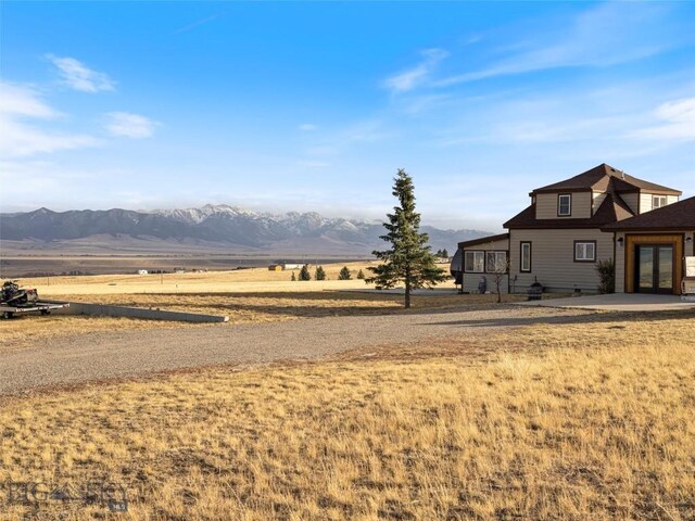193 Tobe Rd, Ennis, MT 59729 - view of yard featuring french doors and a mountain view